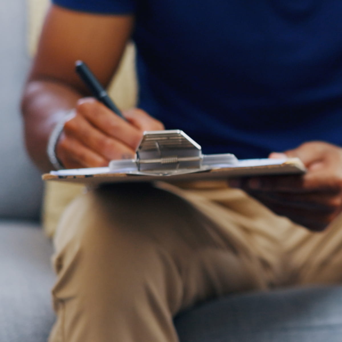 Man signs clipboard